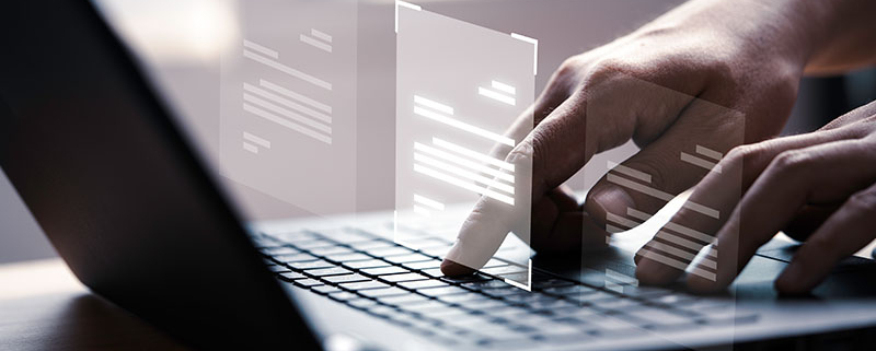 hand-using-laptop-with-virtual-document-scanned-and-sent