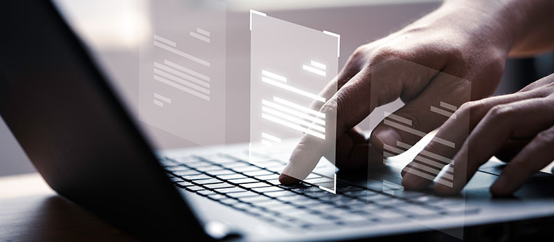 hand-using-laptop-with-virtual-document-scanned-and-sent hand-using-laptop-with-virtual-document-scanned-and-sent