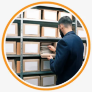 Sealed document boxes prepared for collection by an external scanning provider.